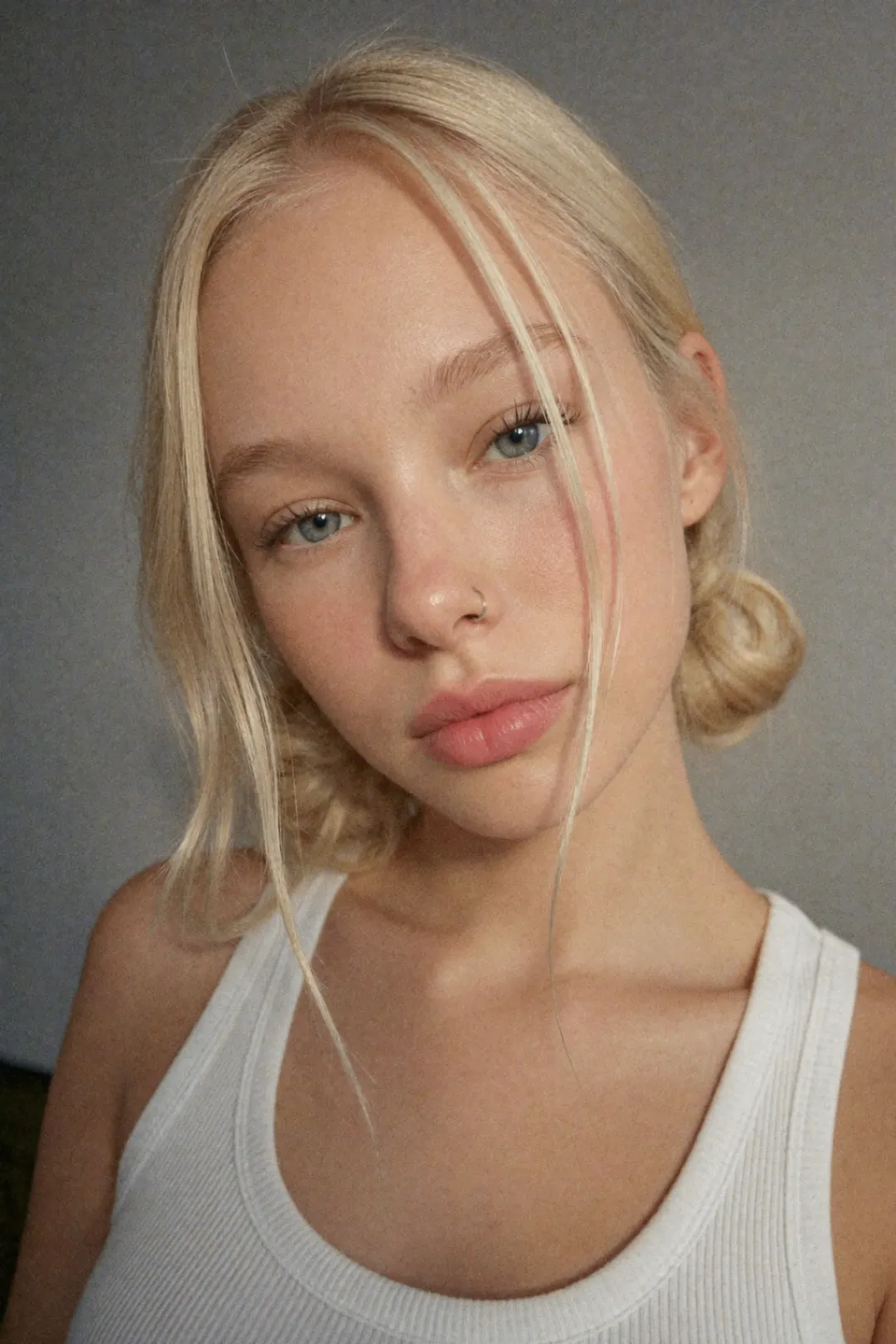 AI Model 1 studio-style portrait with tied hair